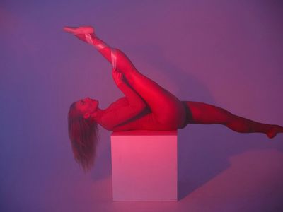 Dynamic silhouette of an athlete in motion in a studio.